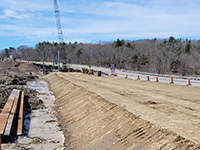 Construction of the temporary roadway, looking south towards existing Station 46 Bridge and the railroad tracks.